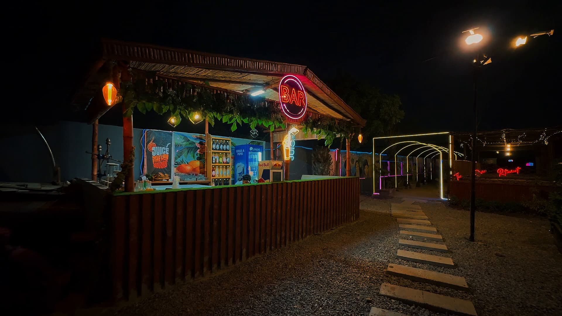Juice and shake counter under a neon BAR sign